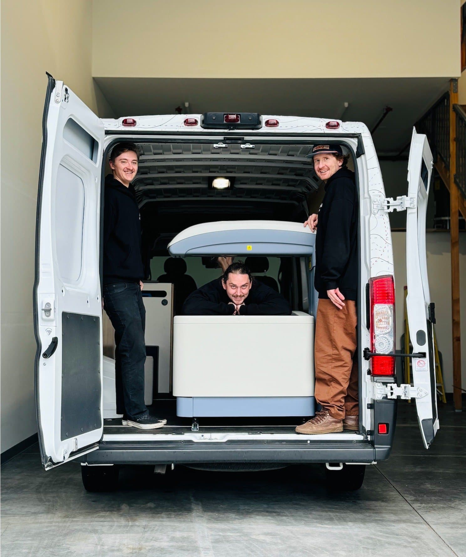 The Nomad Fit Lab team with the mobile DEXA scanner